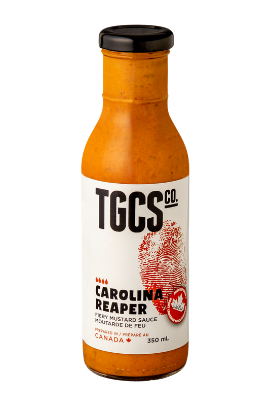 Bottle of TGCS Carolina Reaper hot sauce on a white background